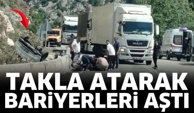 Otomobil takla atarak bariyerleri aştı
